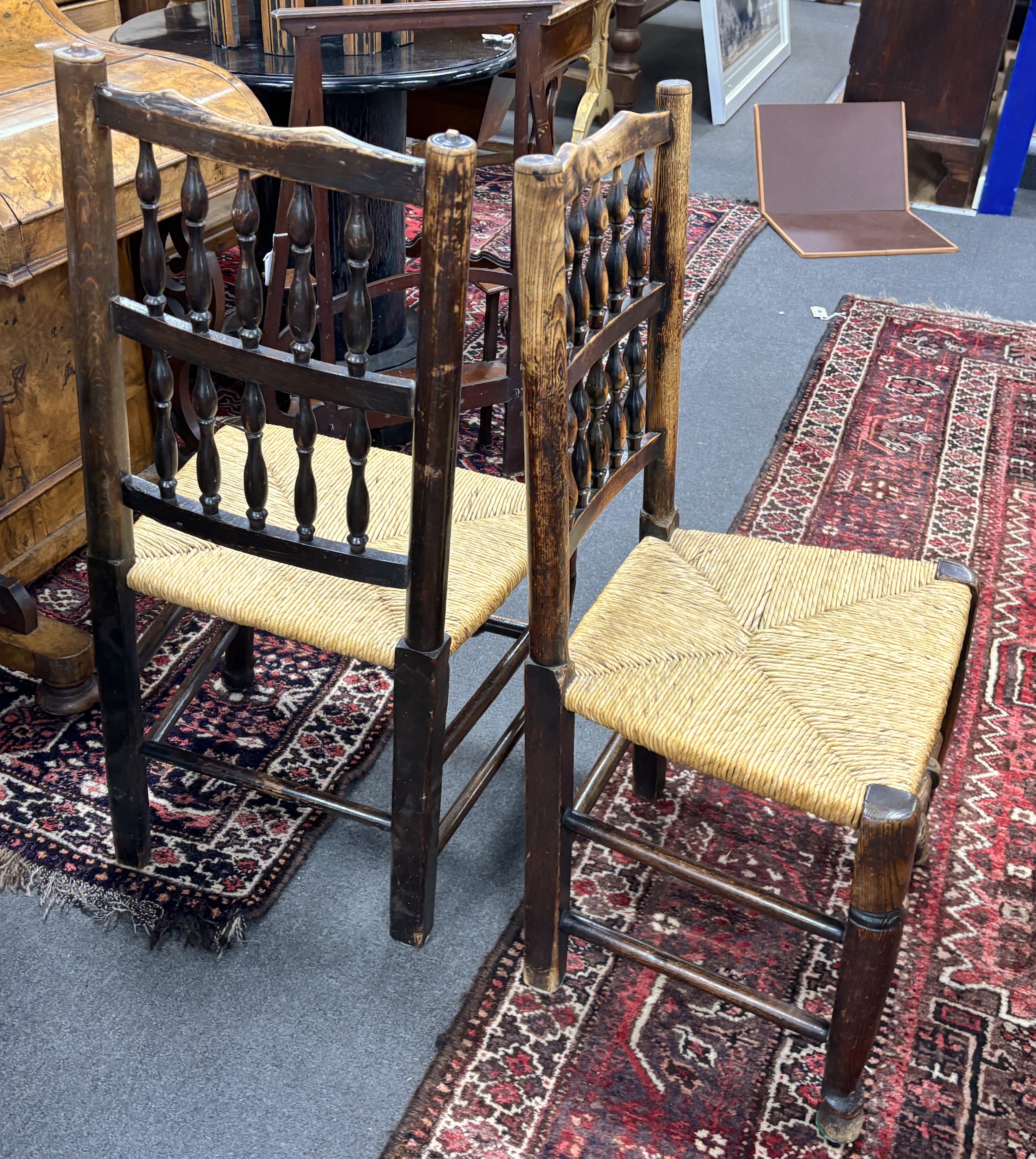 A set of four Lancashire ash and beech rush seat dining chairs. Condition - fair